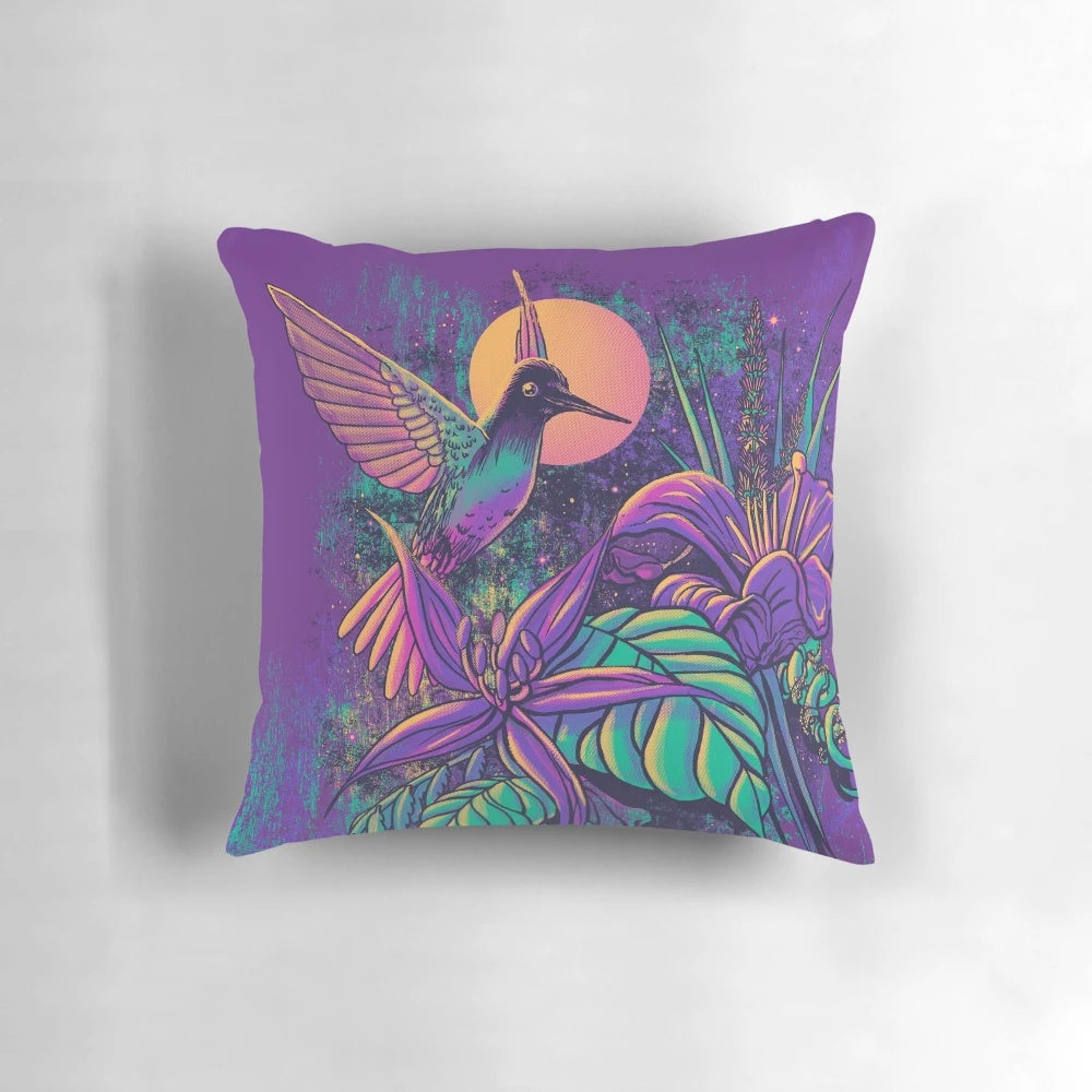 Colorful purple pillow with artistic design featuring hummingbirds and botanical flowers