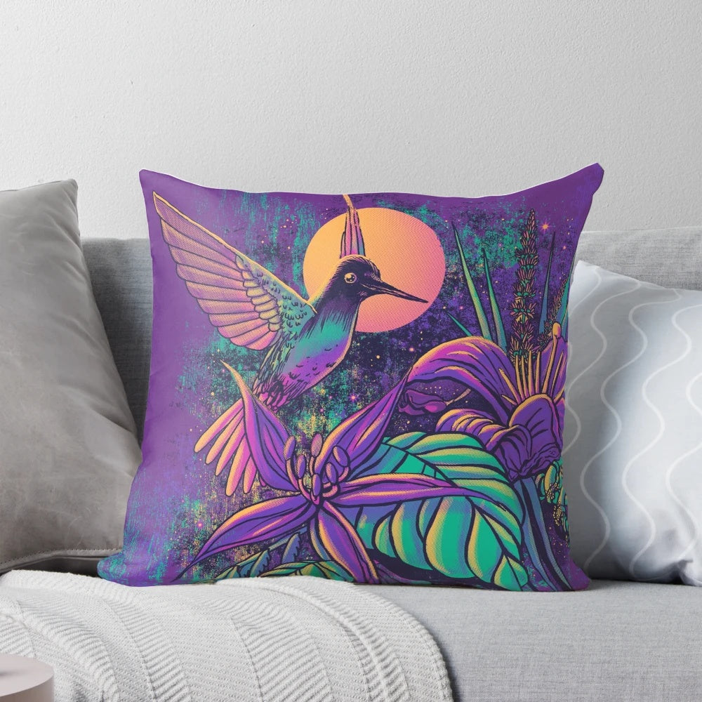 Colorful purple pillow with artistic design featuring hummingbirds and botanical flowers
