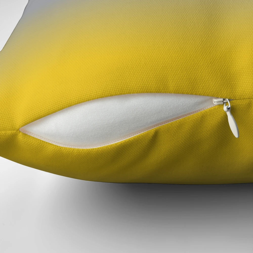 A plush, decorative throw pillow featuring a gradient design in shades of purple, grey, and yellow.