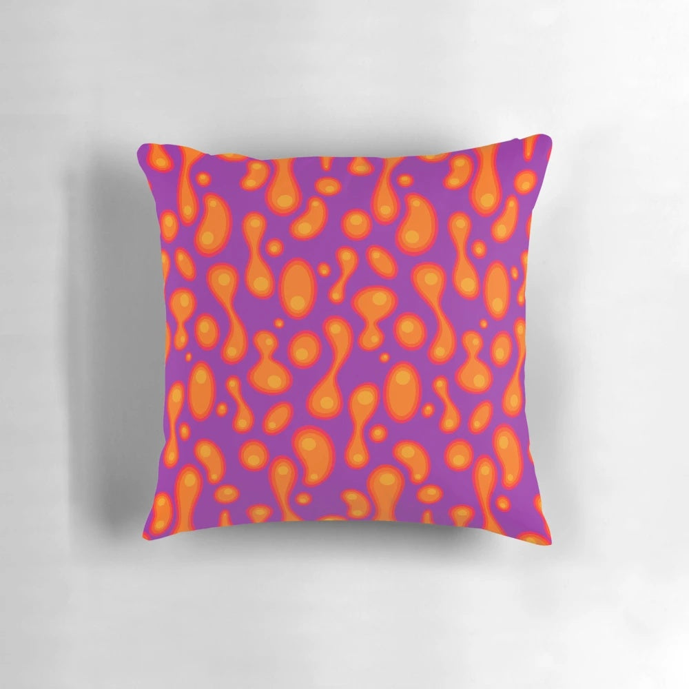 Colorful purple lava lamp inspired pillow with a groovy, retro 70s design