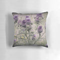 Close-up of a purple thistle and yellow daisy floral pattern on a decorative throw pillow