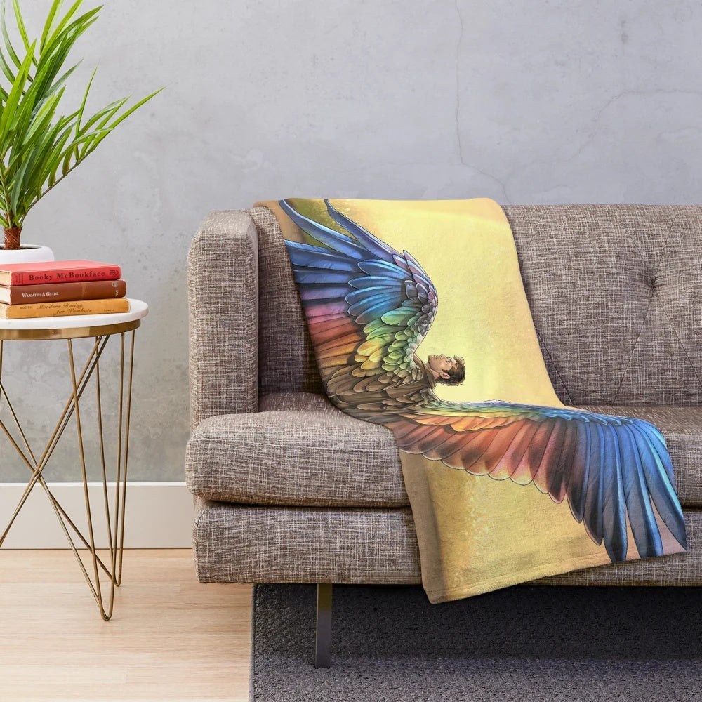 Colorful plush blanket featuring an angel with rainbow wings, inspired by Supernatural