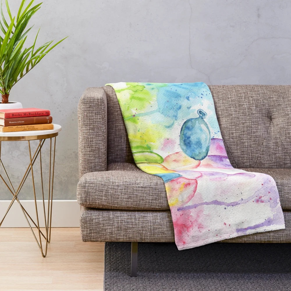 Colorful plush blanket featuring a whimsical rainbow balloon dog design