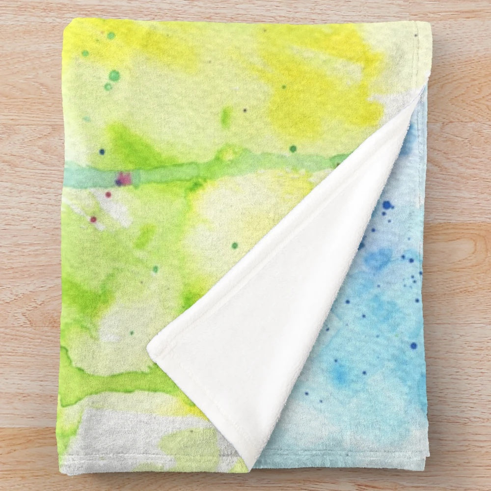 Colorful plush blanket featuring a whimsical rainbow balloon dog design