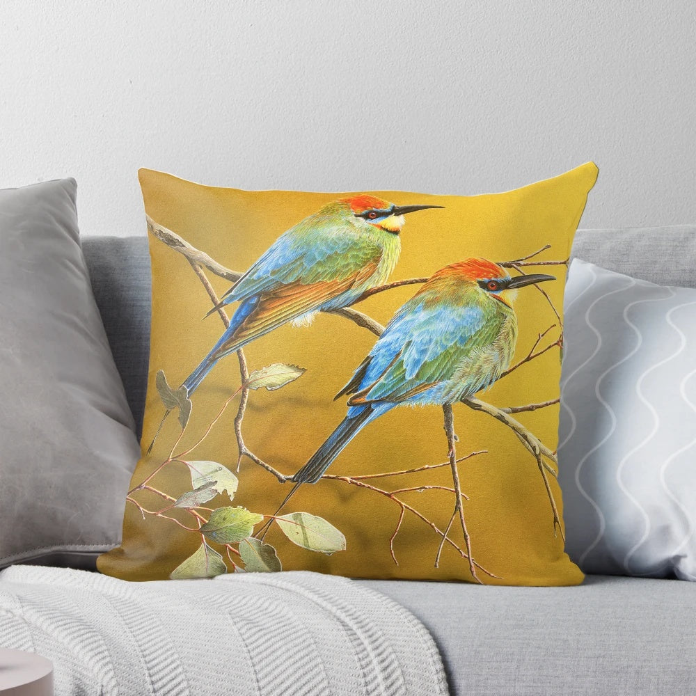Colorful image of a rainbow bee-eater perched on a gum tree branch, showcasing its vibrant plumage and surrounded by lush foliage.