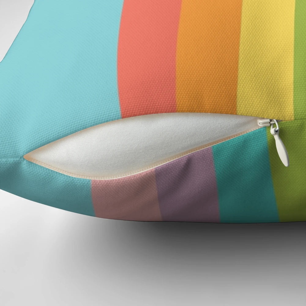 Vibrant rainbow cloud-shaped minimalist pillow in pop art style, perfect for celebrating pride and happiness.