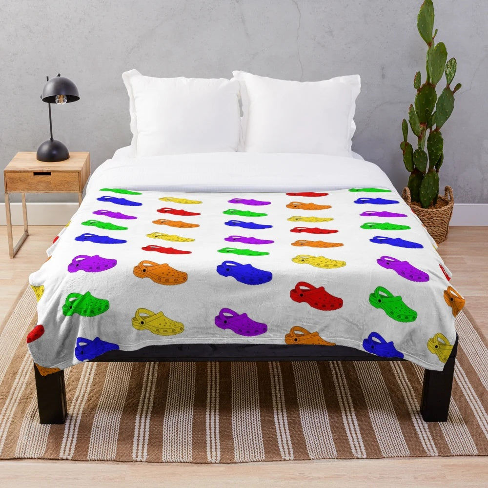 Colorful rainbow plush blanket with crocs-inspired pattern
