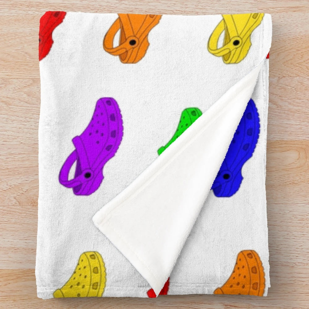 Colorful rainbow plush blanket with crocs-inspired pattern