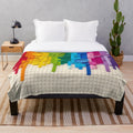 Colorful rainbow drip plush blanket with lego-inspired xray skeleton design