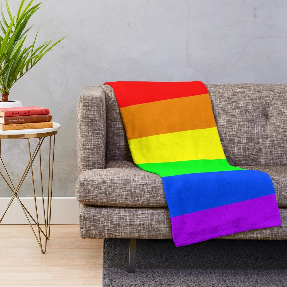 Plush throw blanket in the colors of the rainbow pride flag