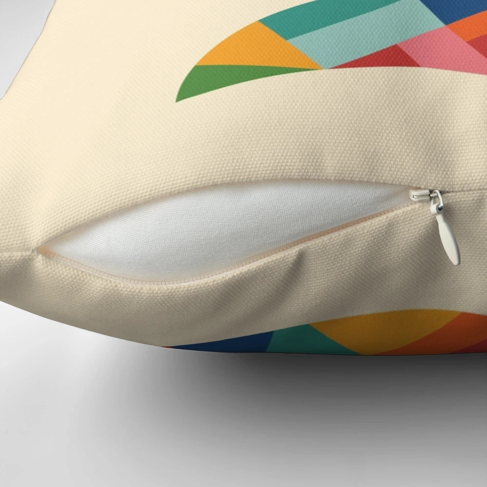 A colorful and whimsical pillow featuring a rainbow-hued fox in a lush, forest landscape.
