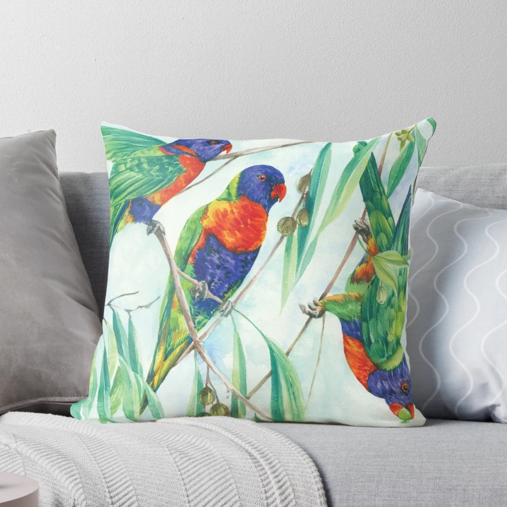 Colorful image of a rainbow lorikeet, a vibrant and cheeky Australian parrot, on a decorative throw pillow.