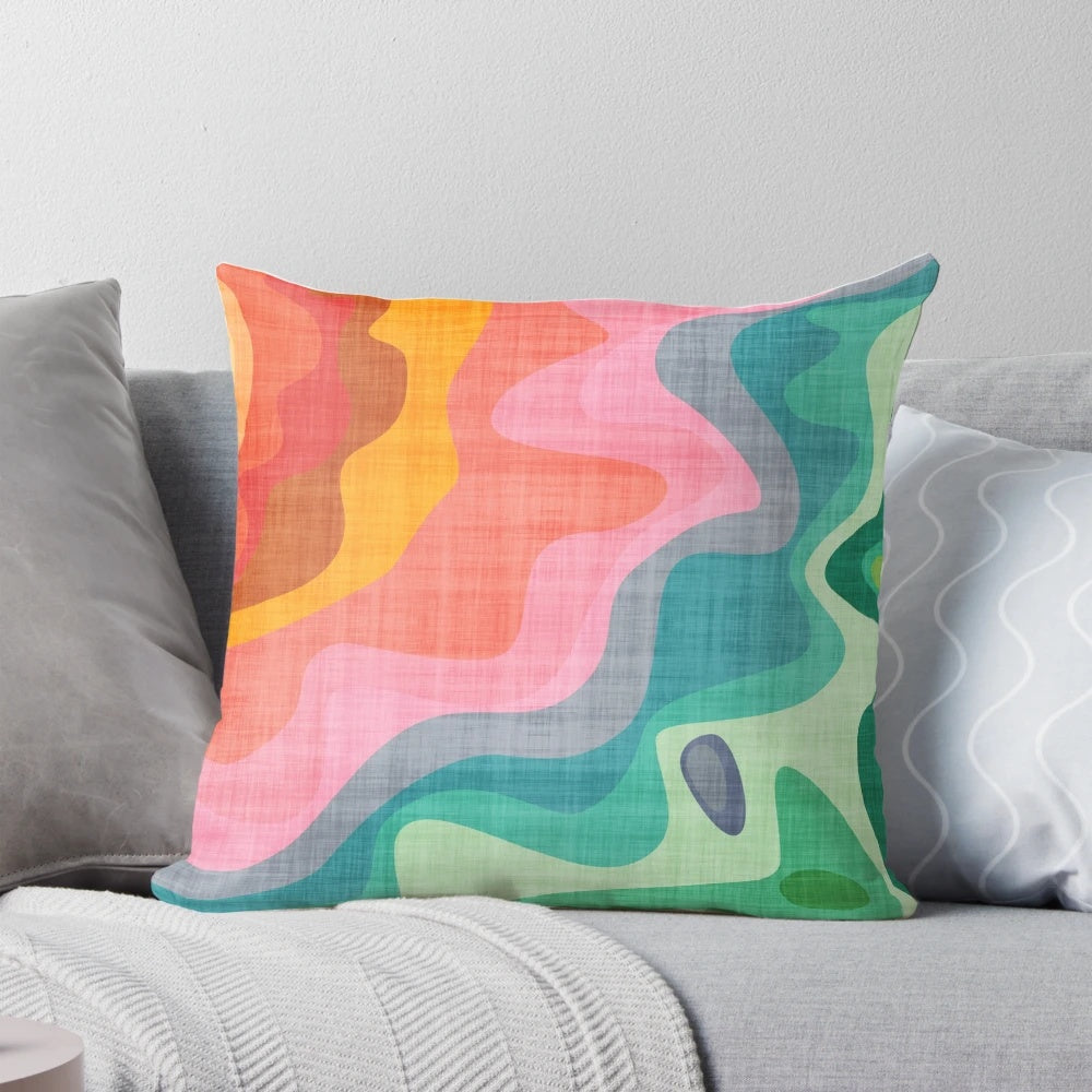 Flouncy, brightly colored rainbow pillow with a fun, abstract pattern