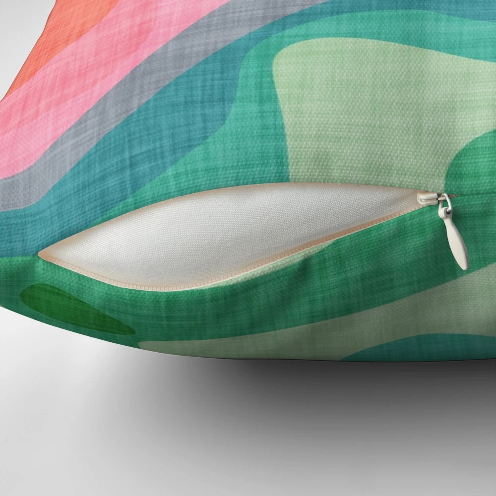 Flouncy, brightly colored rainbow pillow with a fun, abstract pattern