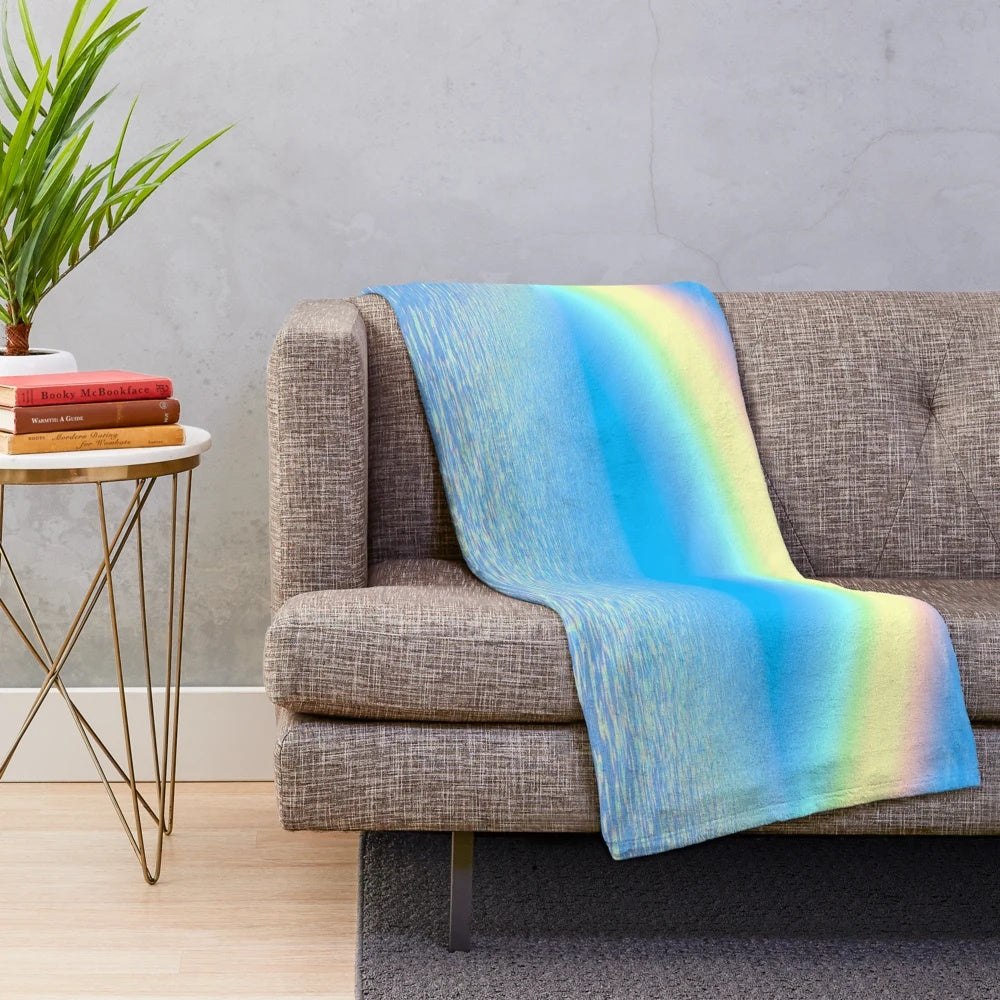 Colorful rainbow plush blanket with abstract patterns