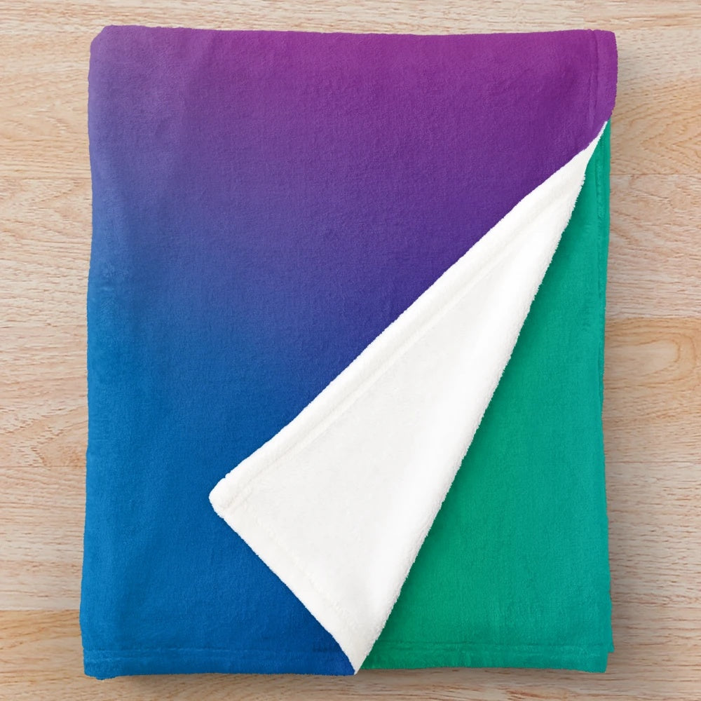 Soft, colorful rainbow plush blanket
