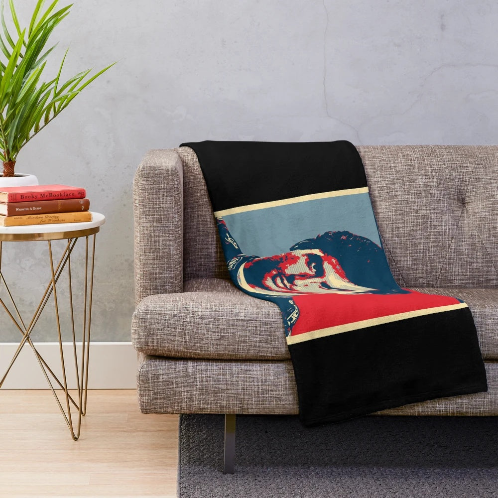 Colorful rainbow plush blanket with motorsport driver Carlos Sainz's name and racing car design