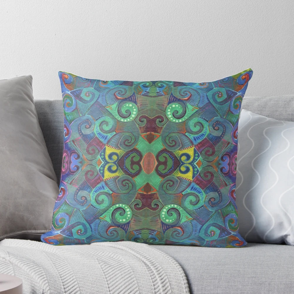 Colorful rainbow swirl design pillow with blue and green hues