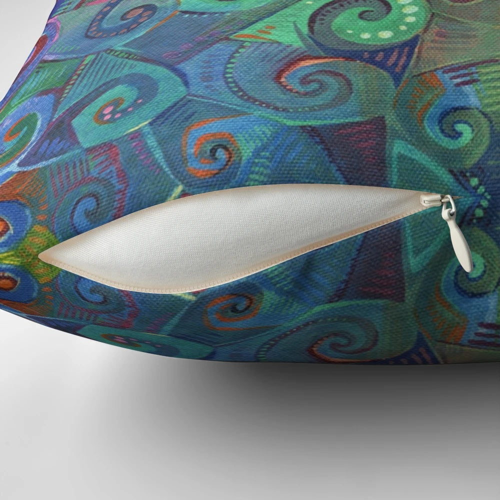 Colorful rainbow swirl design pillow with blue and green hues