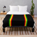 Rasta-inspired plush blanket with vibrant colors and patterns