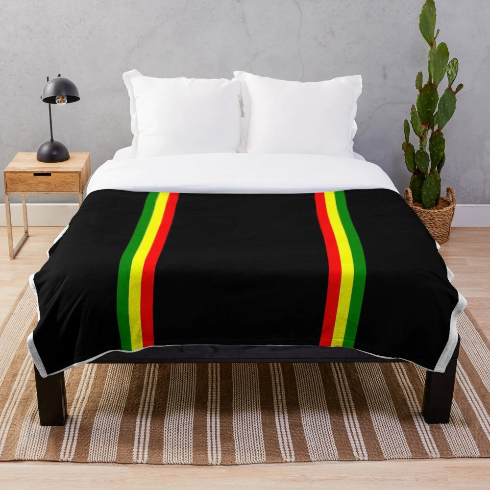 Rasta-inspired plush blanket with vibrant colors and patterns