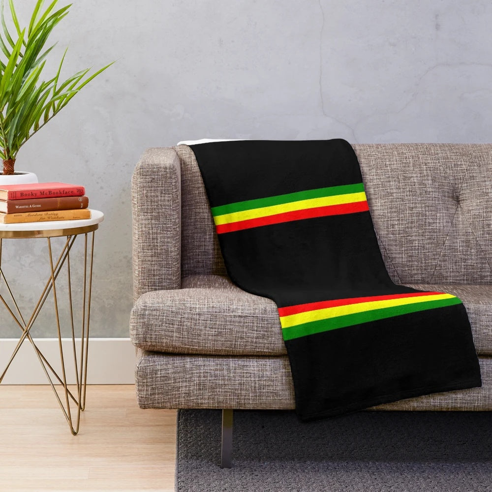 Rasta-inspired plush blanket with vibrant colors and patterns