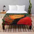 Colorful plush blanket featuring a dot art design of three little birds against a rasta-inspired background