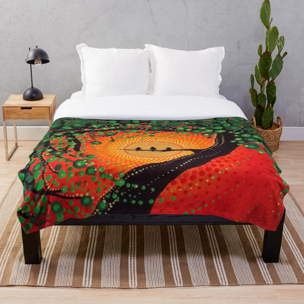 Colorful plush blanket featuring a dot art design of three little birds against a rasta-inspired background