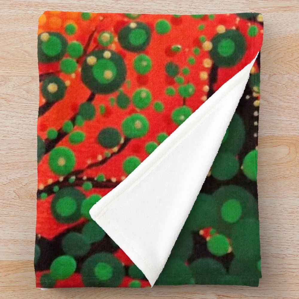 Colorful plush blanket featuring a dot art design of three little birds against a rasta-inspired background