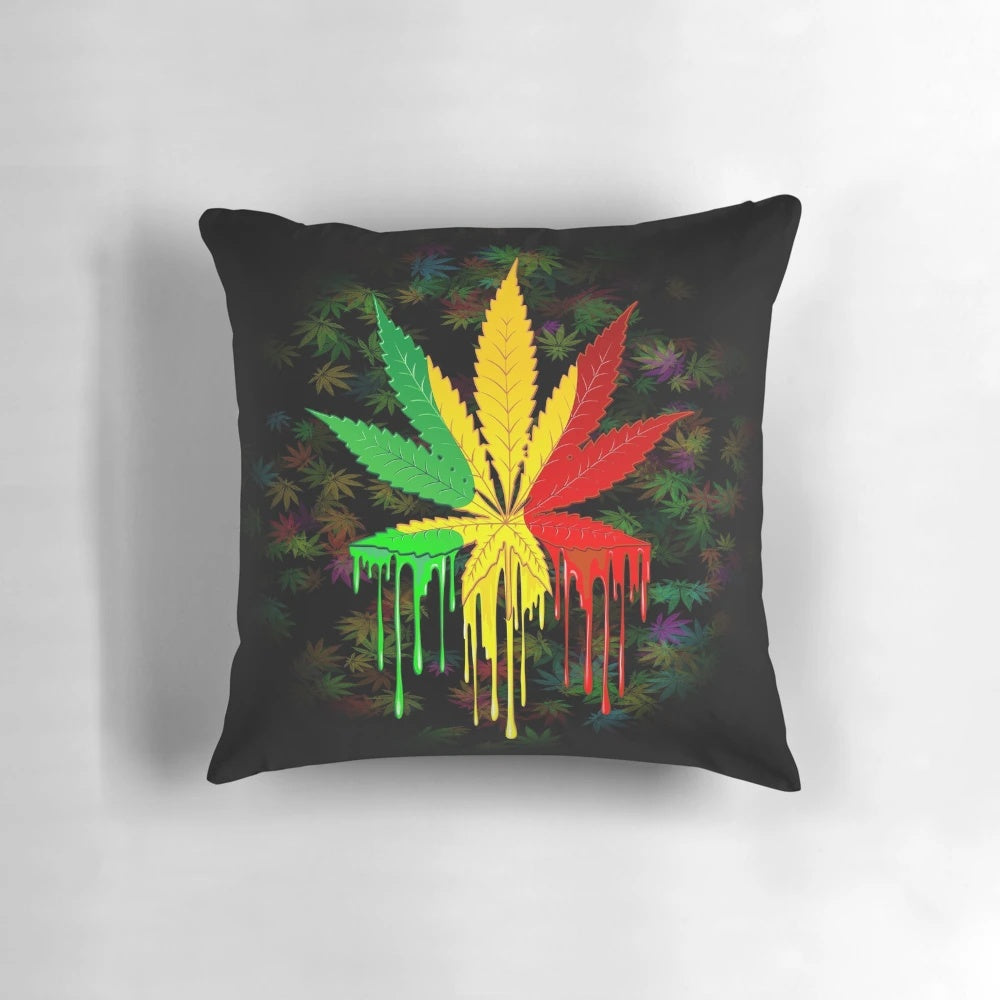 Colorful rasta-inspired leaf pillow with dripping paint design