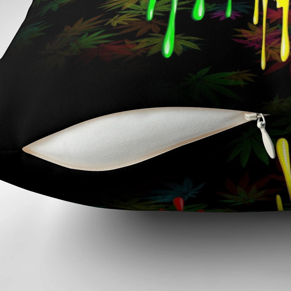 Colorful rasta-inspired leaf pillow with dripping paint design