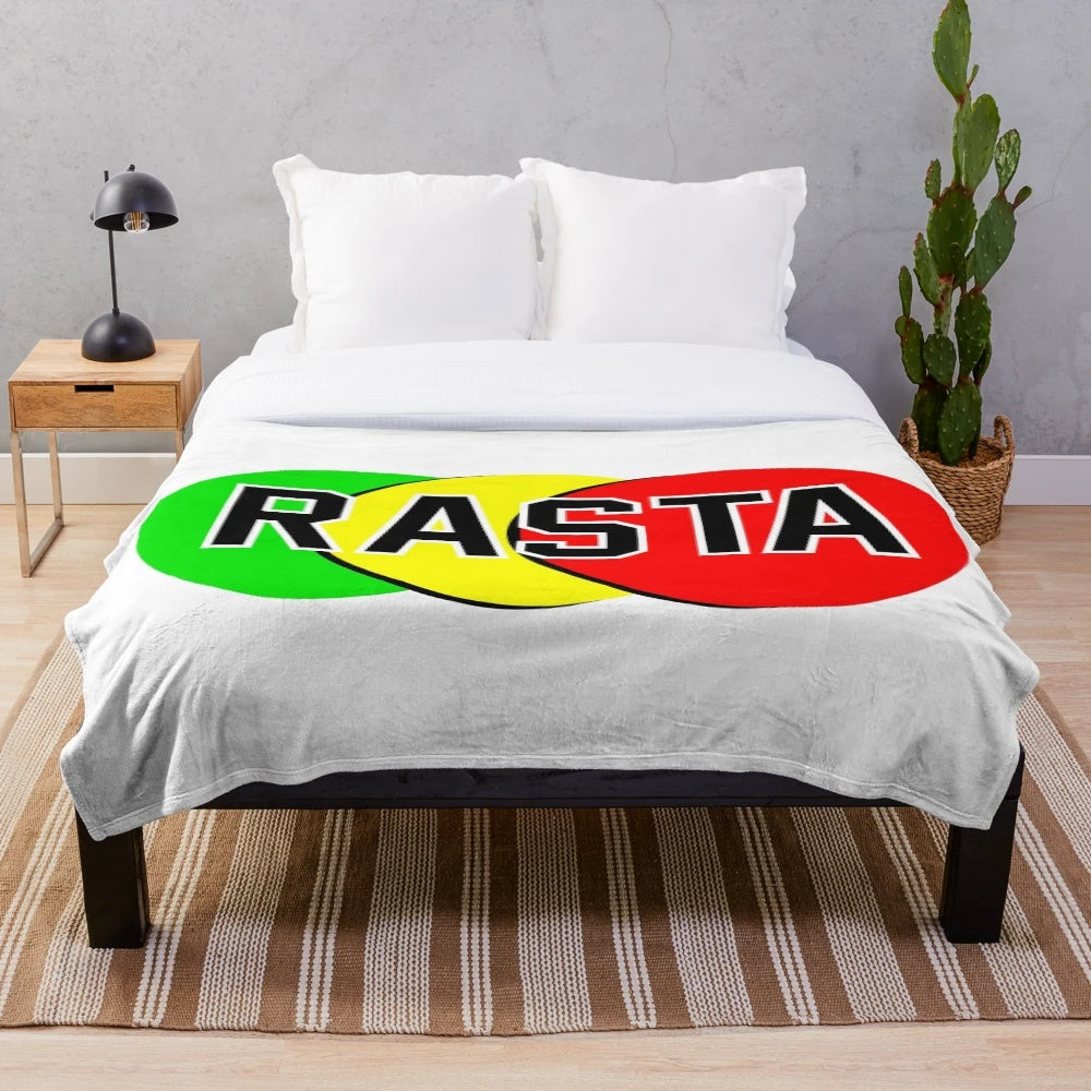 Rasta emblem in green, yellow, and red colors on a soft, plush blanket