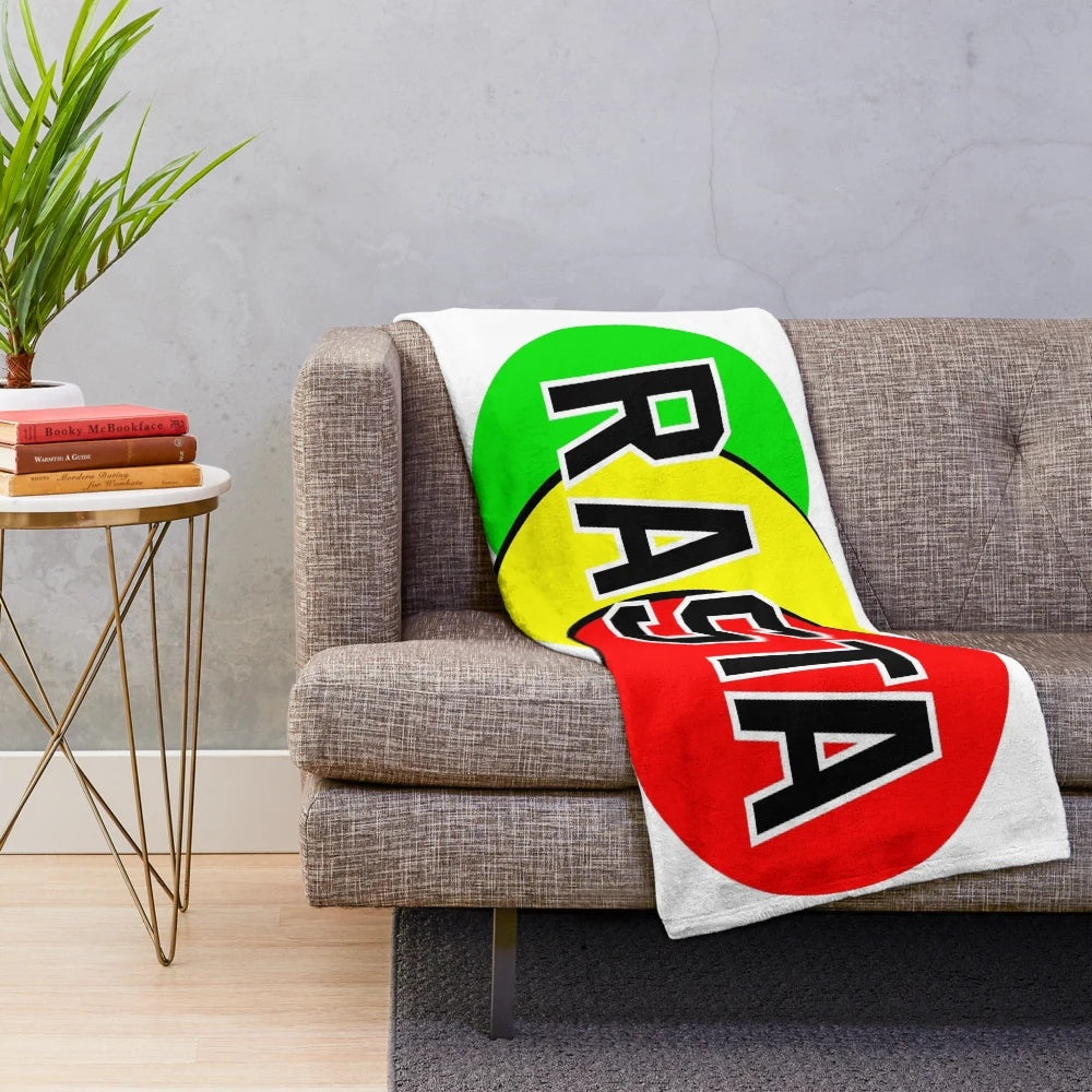 Rasta emblem in green, yellow, and red colors on a soft, plush blanket