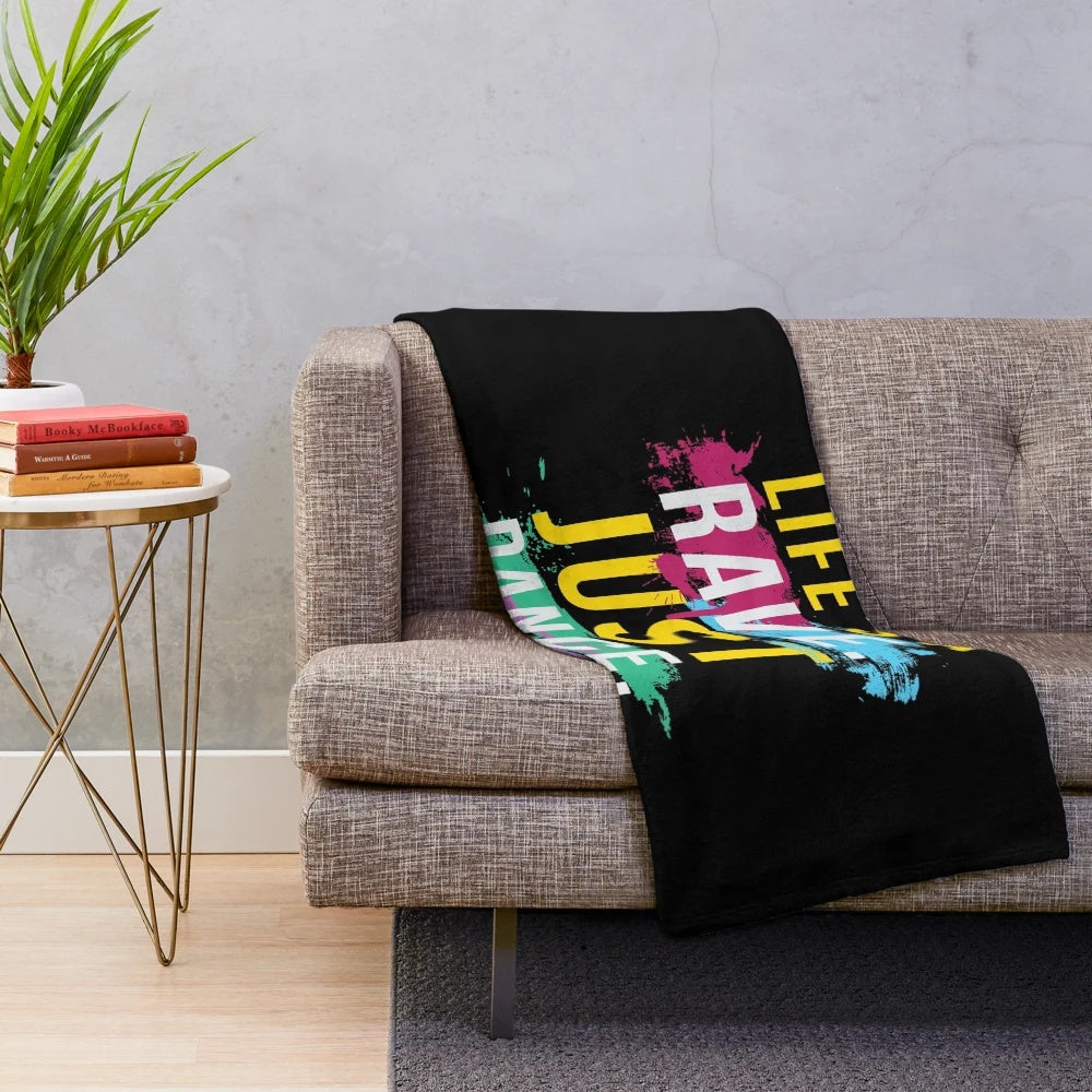Colorful plush blanket featuring rave and music festival inspired design
