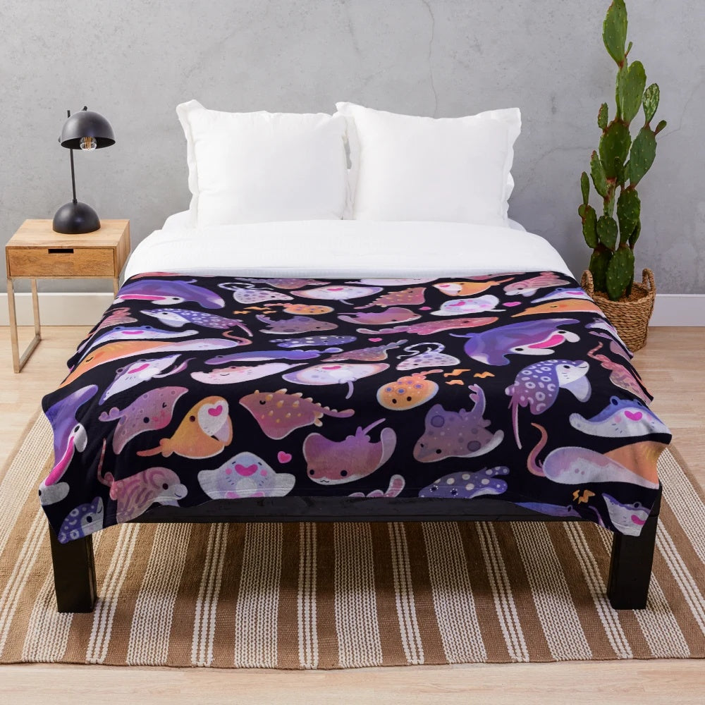 Plush blanket featuring a colorful ray design