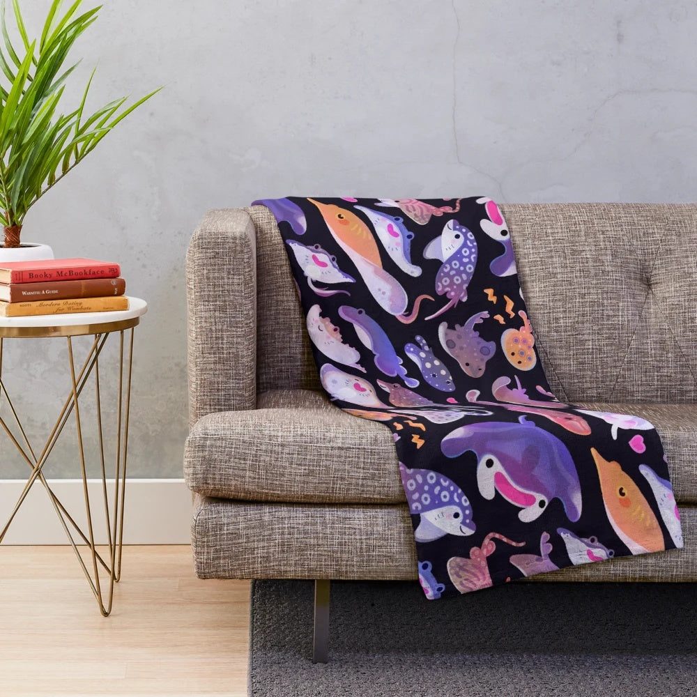 Plush blanket featuring a colorful ray design