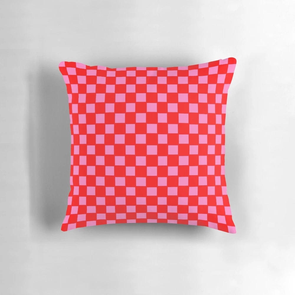 Colorful checkered pattern pillow in red and pink shades for bedroom, living room or kitchen