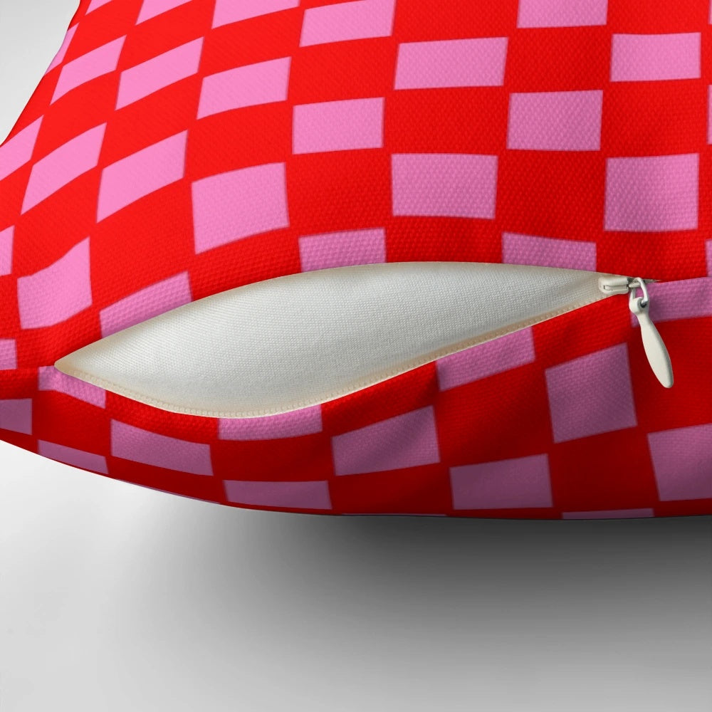 Colorful checkered pattern pillow in red and pink shades for bedroom, living room or kitchen