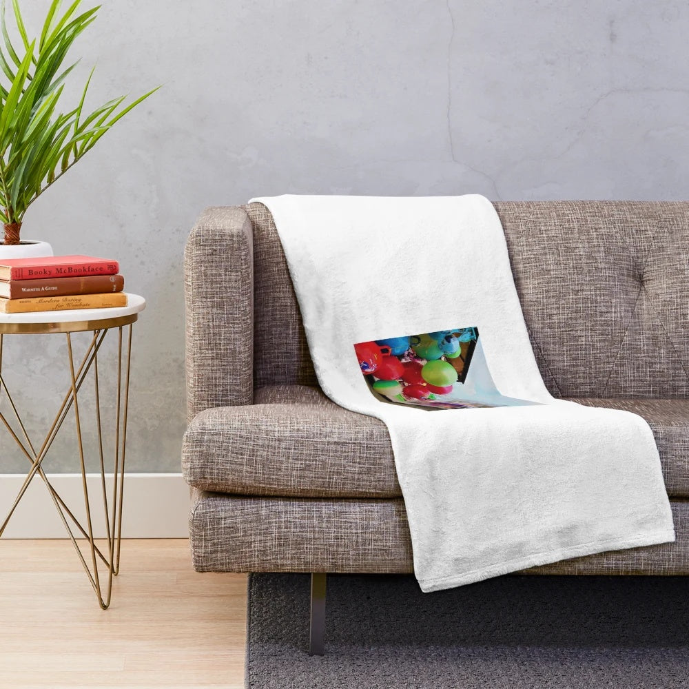 Soft, plush blanket featuring a playful red balloon design