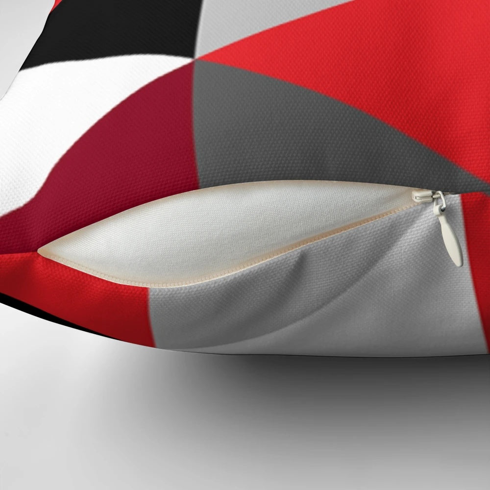 Stylish geometric pattern pillow in shades of red, black, white and grey
