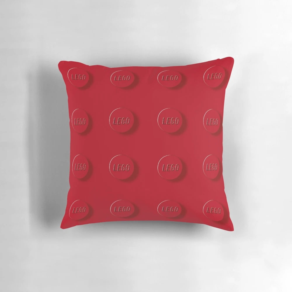 Colorful red building blocks design pillow, perfect for a modern kids room or living space.