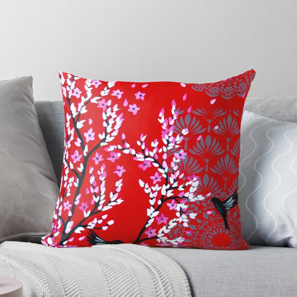 Red and pink cherry blossom floral pattern on a decorative throw pillow
