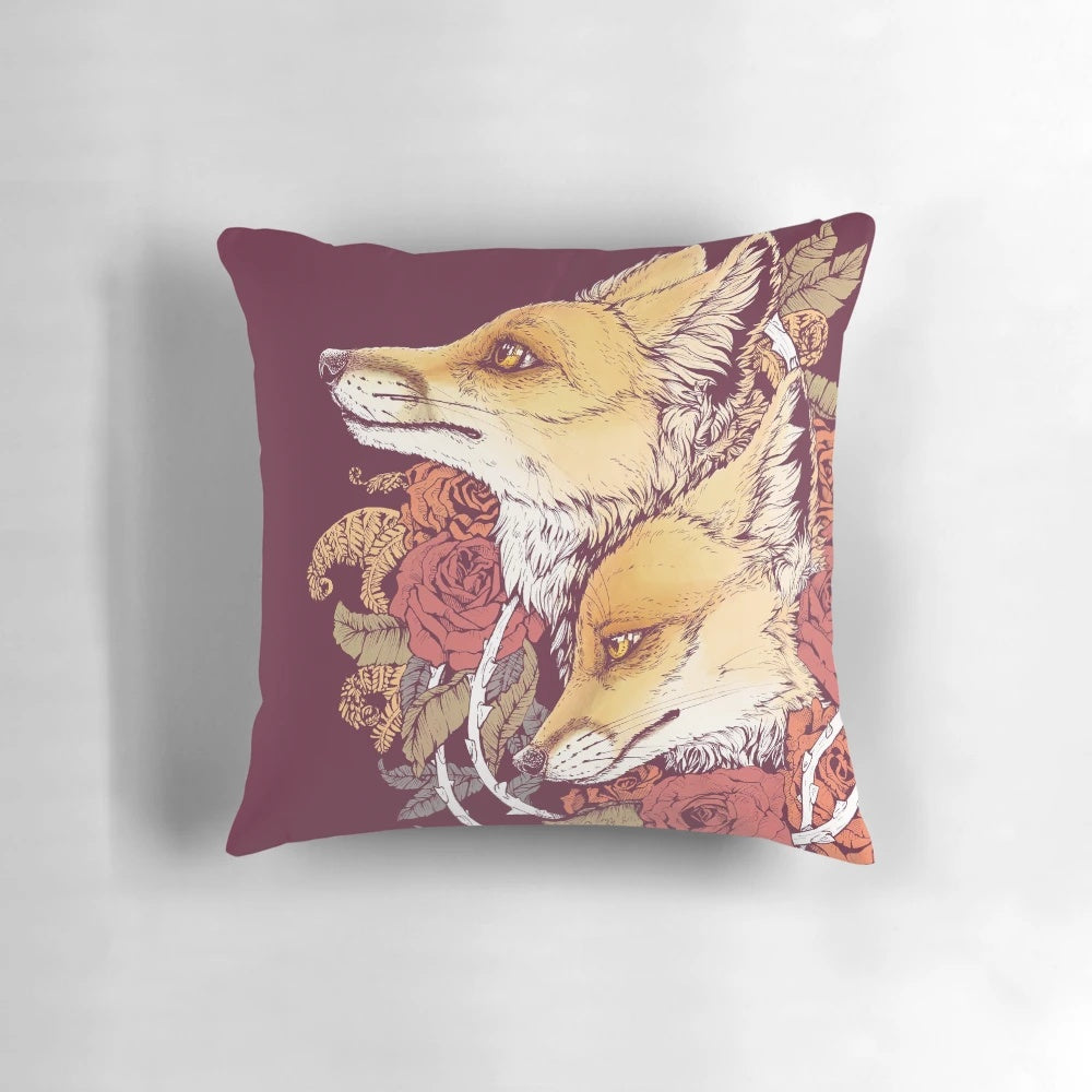 A vibrant red fox bloom pillow with a floral nature motif.