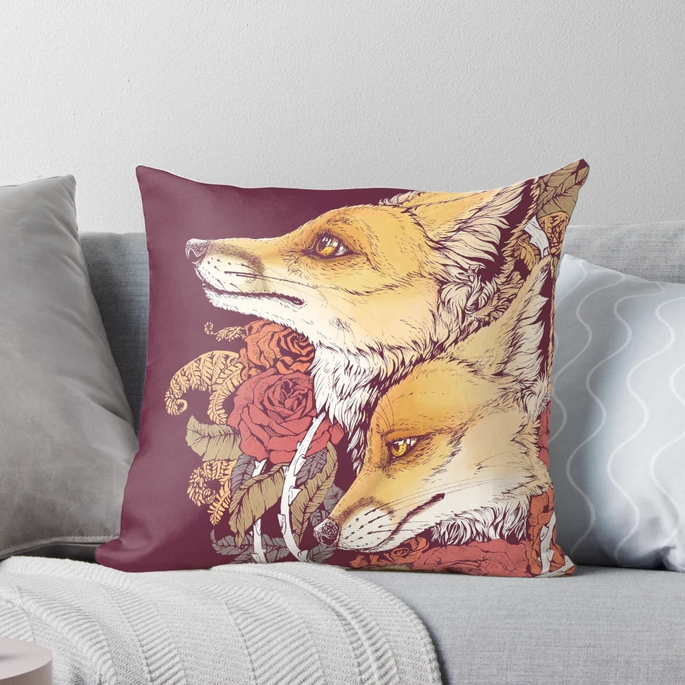 A vibrant red fox bloom pillow with a floral nature motif.