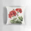 Colorful red geranium flowers printed on a decorative throw pillow