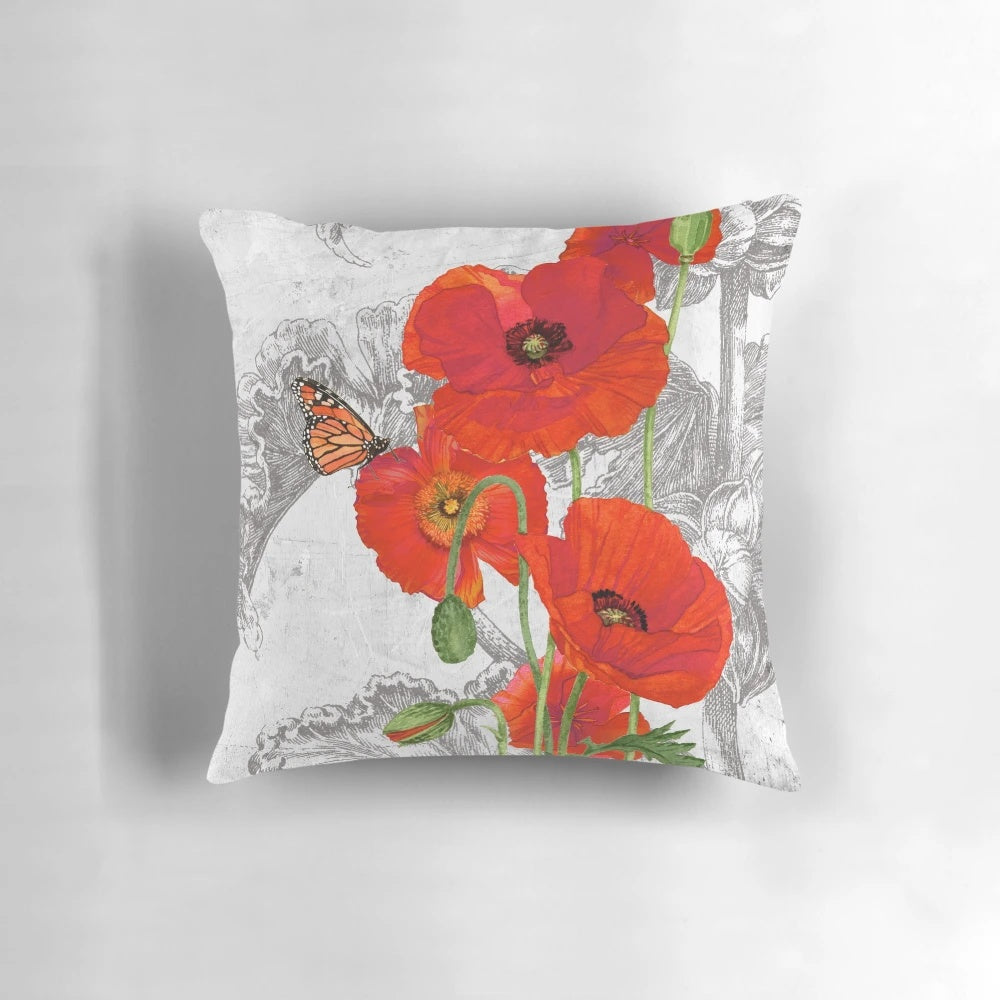 Decorative throw pillow featuring a vibrant watercolor painting of red poppies by artist Lynnea Washburn.