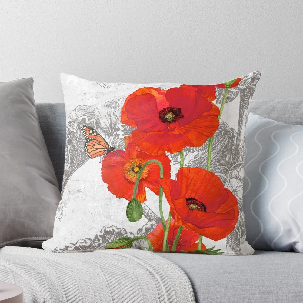 Decorative throw pillow featuring a vibrant watercolor painting of red poppies by artist Lynnea Washburn.