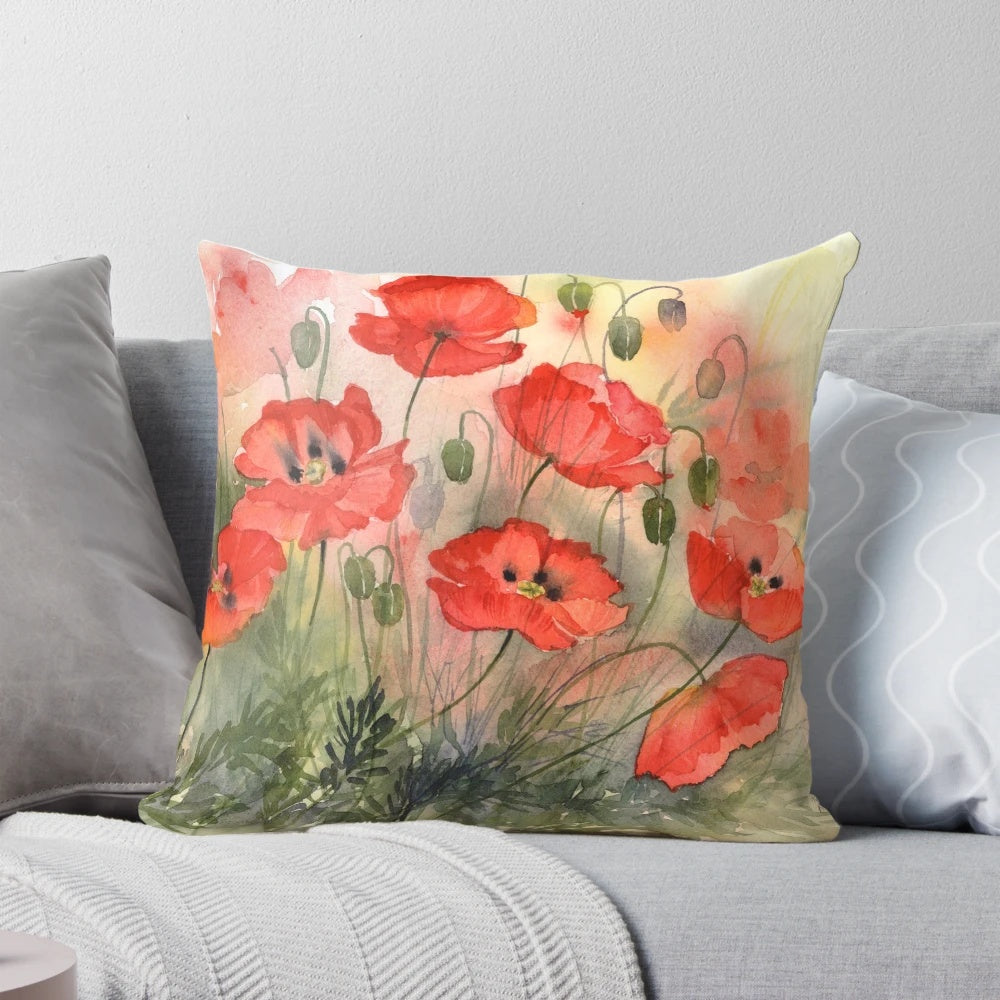 Watercolor painting of vibrant red poppy flowers on a pillow