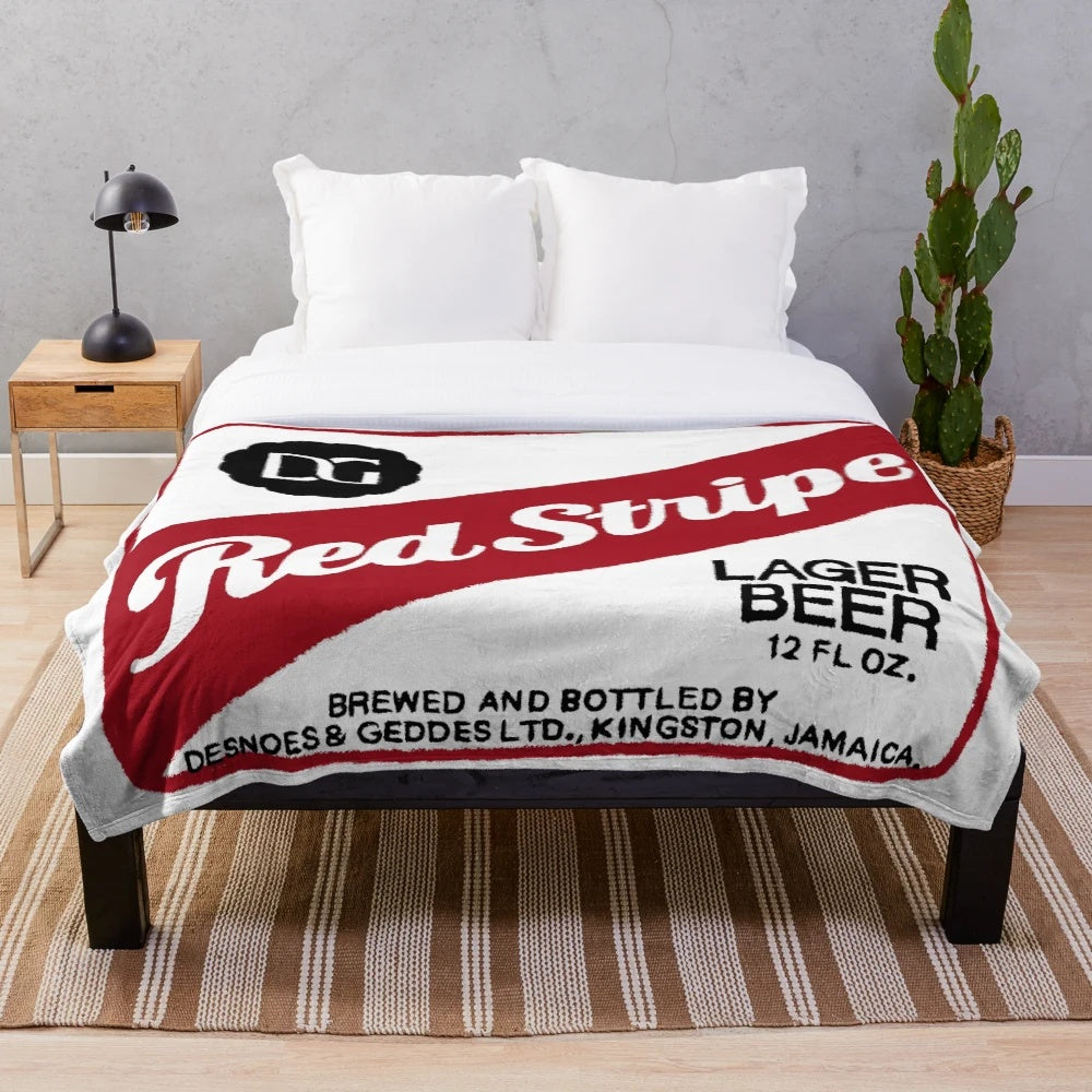 Red stripe plush blanket with beer logo design