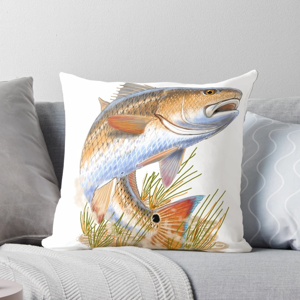 Pillow featuring a vibrant illustration of a redfish swimming in a grassy coastal scene, designed by marine artist Carey Chen.